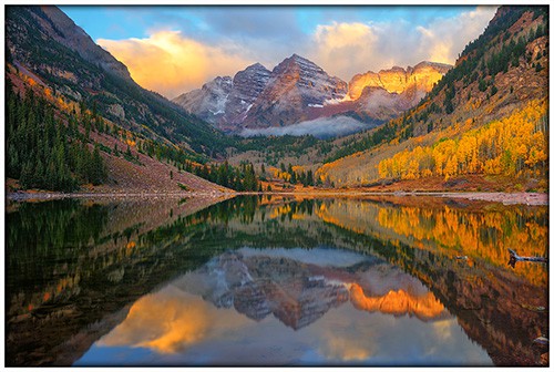 Morning reflections of the Maroon Bells along Maroon Lake in Colorado